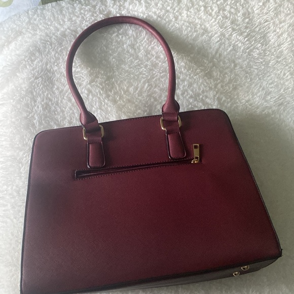 Gently used burgundy colored handbag with gold accents - Picture 5 of 6